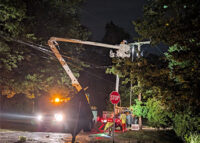 Utility worker in bucket truck.
